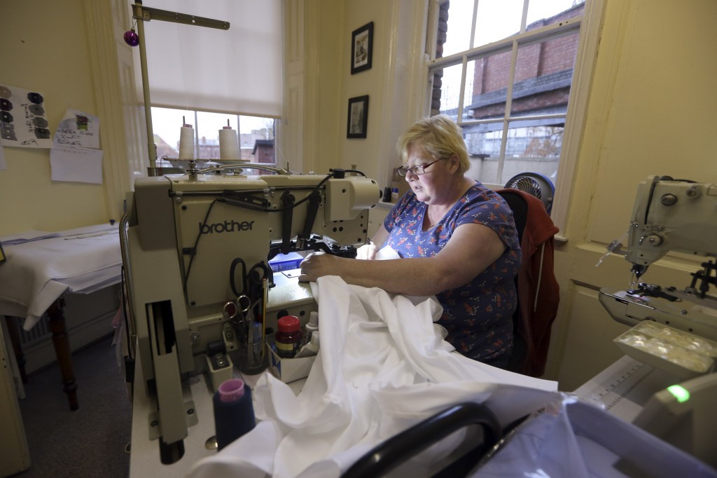 An employee stitches a shirt at the Emma Willis factory in Gloucester.