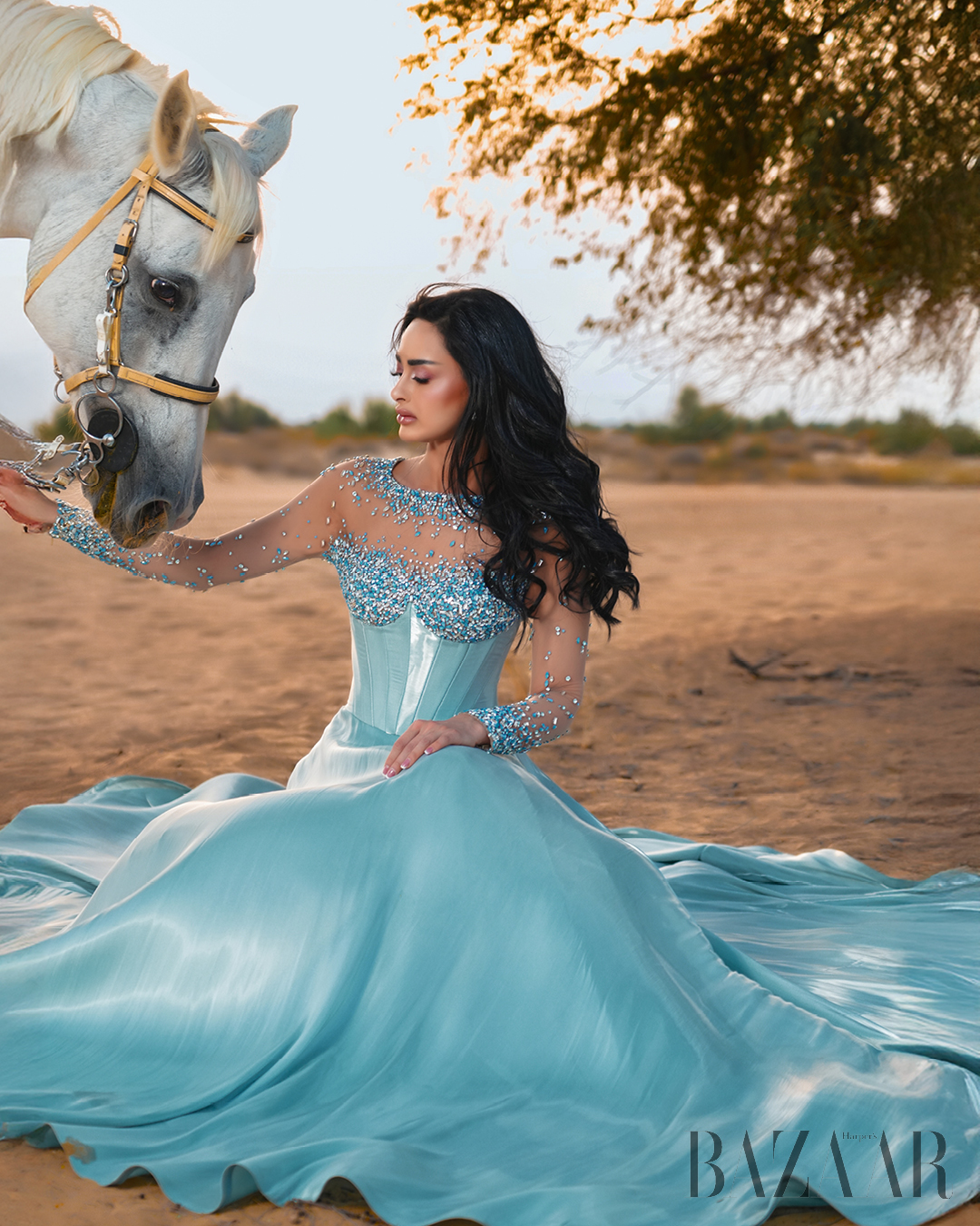 Dr. Mahra Lutfi in a lovely blue dress by Michael Cinco.