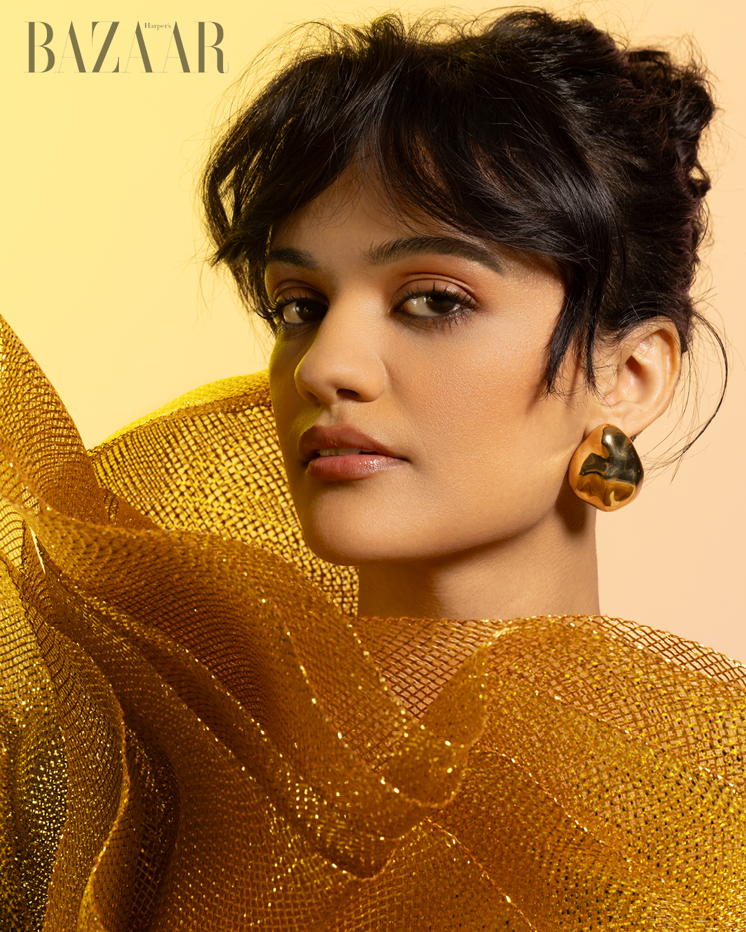 Diễn viên Marissa Bode, ngôi sao nổi lên từ bộ phim Wicked, xinh xắn và ấn tượng trong mẫu đầm lưới màu gold ấm áp.